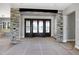 Stone columns accent the entry way to a living area with outdoor access at 6509 Zebulon Rd, Wake Forest, NC 27587