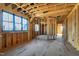 Bright framed living room featuring large windows for ample natural light at 6509 Zebulon Rd, Wake Forest, NC 27587