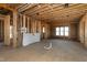 Spacious living room with exposed wood beams and abundant natural light at 6509 Zebulon Rd, Wake Forest, NC 27587