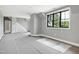 Spacious living room with staircase and a large window with outside view at 6509 Zebulon Rd, Wake Forest, NC 27587