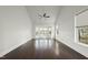 A spacious bedroom with a high ceiling, bay window and luxury vinyl plank flooring at 7220 Hasentree Way, Wake Forest, NC 27587