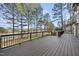 Open deck with railings and a stunning view of the backyard at 7220 Hasentree Way, Wake Forest, NC 27587