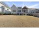 Spacious backyard with a lush lawn and back porch at 729 Daniel Ridge Rd, Wendell, NC 27591