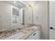 Bathroom features granite countertop with double sinks, decorative light fixture, and neutral walls at 729 Daniel Ridge Rd, Wendell, NC 27591