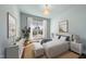 Inviting bedroom with calming blue walls, natural light, stylish decor, creating a serene and comfortable retreat at 729 Daniel Ridge Rd, Wendell, NC 27591
