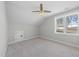 Simple bedroom featuring great light from a single window, ceiling fan, and access to other rooms at 729 Daniel Ridge Rd, Wendell, NC 27591
