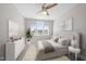 Stylish bedroom features a comfortable bed, matching furniture, and windows that offer a neighborhood view at 729 Daniel Ridge Rd, Wendell, NC 27591