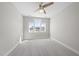 The bedroom boasts lots of natural light and overhead lighting provided by the ceiling fan fixture at 729 Daniel Ridge Rd, Wendell, NC 27591