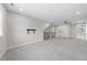 This large, open bonus room provides plenty of natural light from the windows and access to other rooms at 729 Daniel Ridge Rd, Wendell, NC 27591