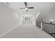 The bonus room boasts great light and space, with stairs that lead back to the lower floors at 729 Daniel Ridge Rd, Wendell, NC 27591