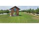 Expansive community park featuring well-manicured lawns, walking paths, and a rustic wooden gazebo at 729 Daniel Ridge Rd, Wendell, NC 27591