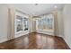 Bright dining room features hardwood floors, large windows and a modern light fixture, perfect for entertaining at 729 Daniel Ridge Rd, Wendell, NC 27591