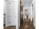 Hallway with white trim and a sliding wooden barn door leading to living area at 729 Daniel Ridge Rd, Wendell, NC 27591