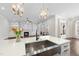 Kitchen island with sink overlooking living room with fireplace and built-in bookshelves at 729 Daniel Ridge Rd, Wendell, NC 27591