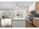Bright kitchen with white counters, wood cabinets, a black backsplash, and stainless steel appliances at 729 Daniel Ridge Rd, Wendell, NC 27591