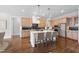 Spacious kitchen featuring a large island, stainless steel appliances, and wood cabinets at 729 Daniel Ridge Rd, Wendell, NC 27591