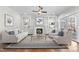 Living room featuring a fireplace, built-in shelving, and glass coffee table at 729 Daniel Ridge Rd, Wendell, NC 27591