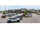 Exterior view of a well-maintained retail center featuring a Publix, ample parking, and pedestrian-friendly walkways at 729 Daniel Ridge Rd, Wendell, NC 27591