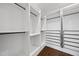 A walk-in closet is highly customizable and features black hanging rods and black drawer pulls for contrast at 729 Daniel Ridge Rd, Wendell, NC 27591