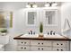 Bright bathroom features double sinks, wood countertop, and vintage-style vanity at 733 Shadywood Ln, Raleigh, NC 27603