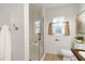 Bathroom featuring tiled shower with glass door, wood-look floors, and neutral paint at 733 Shadywood Ln, Raleigh, NC 27603