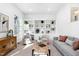 Bright living room features a built-in bookcase and a neutral color palette at 733 Shadywood Ln, Raleigh, NC 27603