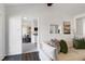 Bright living room featuring wood floors, and views into the kitchen and foyer at 733 Shadywood Ln, Raleigh, NC 27603