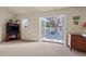 Spacious room with carpet flooring opens to the outdoor pool area via glass doors at 7409 Blalock Rd, Bahama, NC 27503