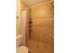 Shower area featuring tile surround, shower head, corner caddy, and curtain at 7712 Falcon Rest Cir, Raleigh, NC 27615
