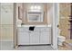 Bathroom with white vanity and an alcove shower, plus closet access at 7712 Falcon Rest Cir, Raleigh, NC 27615