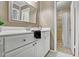 Bathroom with vanity, toilet, and open access to the tiled shower at 7712 Falcon Rest Cir, Raleigh, NC 27615