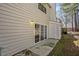 Exterior view showing the side of the home, door, and backyard entrance sliding glass door at 7712 Falcon Rest Cir, Raleigh, NC 27615