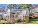 Traditional style townhome with neutral siding, black shutters, and manicured lawn at 7712 Falcon Rest Cir, Raleigh, NC 27615
