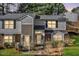 Traditional style townhome with neutral siding, black shutters, and manicured lawn at 7712 Falcon Rest Cir, Raleigh, NC 27615