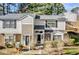 Traditional style townhome with neutral siding, black shutters, and manicured lawn at 7712 Falcon Rest Cir, Raleigh, NC 27615