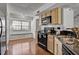 Bright kitchen view featuring modern appliances and a window bench at 7712 Falcon Rest Cir, Raleigh, NC 27615