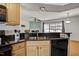 Kitchen view featuring granite countertops and a stainless steel sink at 7712 Falcon Rest Cir, Raleigh, NC 27615