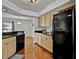 Well-lit kitchen with stainless steel appliances and wood cabinets at 7712 Falcon Rest Cir, Raleigh, NC 27615
