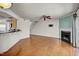 Bright living room featuring a fireplace, ceiling fan and hardwood floors at 7712 Falcon Rest Cir, Raleigh, NC 27615