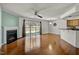 Spacious living room with hardwood flooring, fireplace and sliding glass door to the backyard at 7712 Falcon Rest Cir, Raleigh, NC 27615