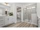 Stylish bathroom with double vanity, a glass-enclosed shower, and ample storage space at 79 Willow Cameron Way, Angier, NC 27501