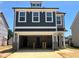 New two story home with a garage and a mix of shingle and gray siding at 79 Willow Cameron Way, Angier, NC 27501