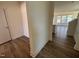 Open foyer leads to the living area, showcasing modern wood-look flooring at 79 Willow Cameron Way, Angier, NC 27501