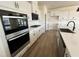 Modern kitchen with stainless steel appliances and a large island at 79 Willow Cameron Way, Angier, NC 27501