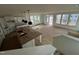 Unfinished kitchen featuring white cabinets, a large island, and natural light from the backyard windows at 79 Willow Cameron Way, Angier, NC 27501
