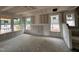 Large living area with multiple windows and prepped walls ready for finishing at 79 Willow Cameron Way, Angier, NC 27501