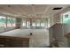 Spacious living area with prepped walls and many windows for ample natural light at 79 Willow Cameron Way, Angier, NC 27501