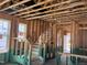 Unfinished staircase showing the frame, steps, and handrail under construction at 79 Willow Cameron Way, Angier, NC 27501
