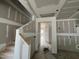 Interior view of a stairwell with prepped drywall walls ready for finishing at 79 Willow Cameron Way, Angier, NC 27501