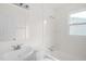 All-white bathroom with tub, shower, and vanity at 809 S Plum St, Durham, NC 27701